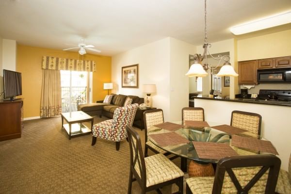 Living room with dining table in Two Bedroom Suite at Lake Buena Vista Resort Village & Spa