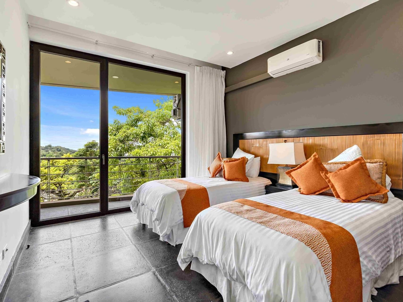 Interior view of Panoramic Ocean View Suites with twin beds at Los Altos Resort