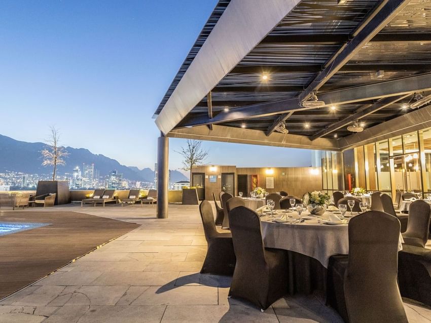 Terraza Vista Cerro de la Silla dining setup on a terrace with a stunning city viewat Camino Real Fashion Drive, Monterrey