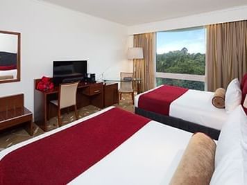 Deluxe Park View Twin Room with two double beds at Royal on the Park hotel