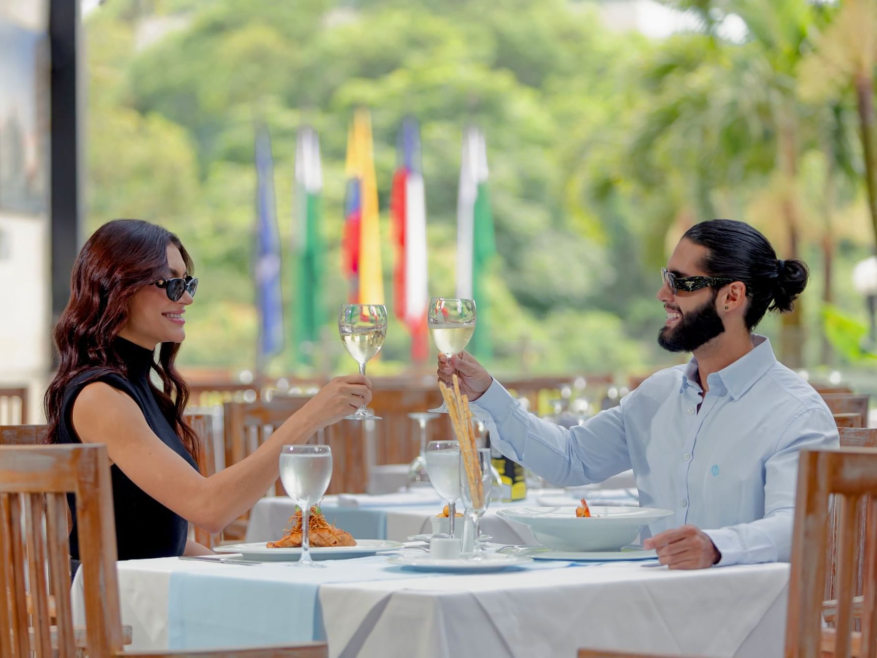 A couple enjoying outdoor dining in 43 Street at Hotel Dann Carlton Medellin