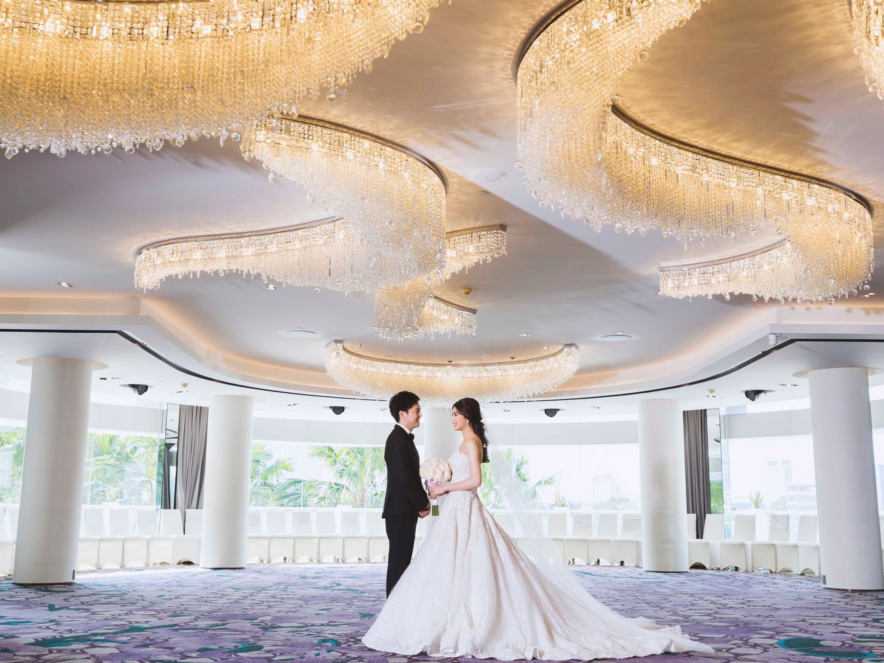 Bride & Groom in an event hall at Chatrium Hotels & Residences