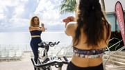 Lady doing exercise in Beachfront Spin Class at Diplomat Beach Resort