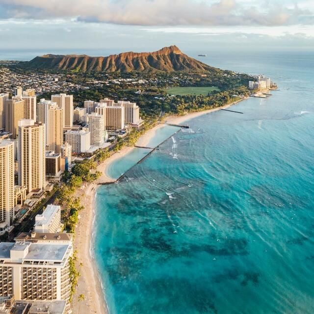 Aerial view of the City & beach on a sunny day near Waikiki Resort Hotel by Sono