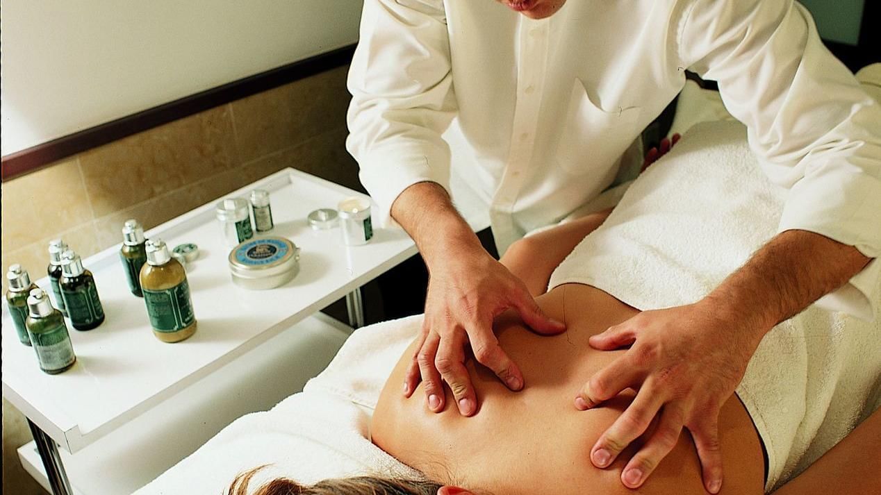 Lady getting massage from the spa at Grand Fiesta Americana