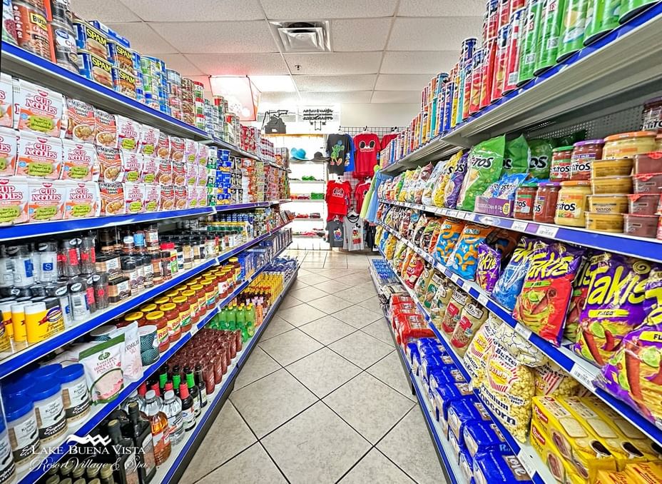 a convenience store aisle with shelves stocked with various products