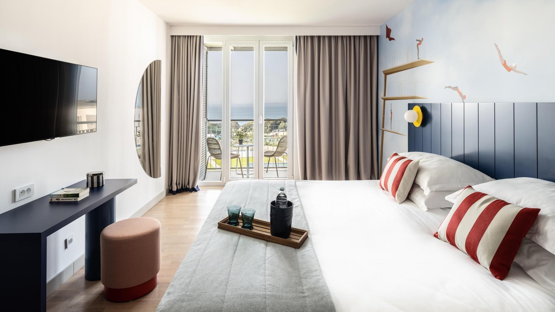 Bed & furniture in Family Suite Deluxe at Falkensteiner Hotels