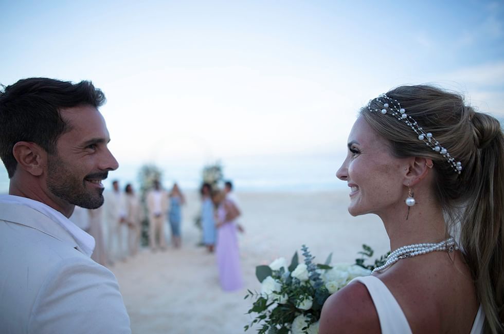 Couple laughing with each other in beach near Live Aqua Resorts and Residence Club