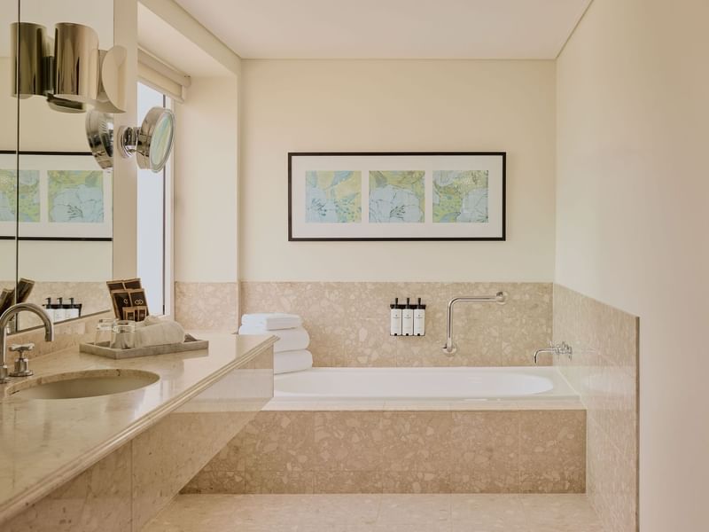 Bathroom with vanity and bathtub in Signature Suite at Sofitel Brisbane Central