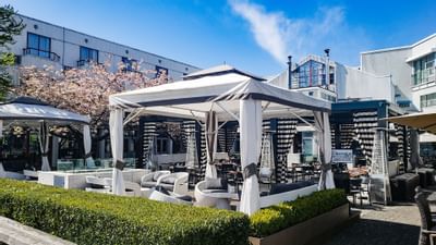 The dockside patio view of cabana at Granville Island Hotel