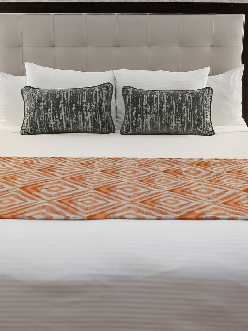 Elegant Premier Room with a king bed and a patterned blanket at Warwick New York