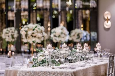 Floral table decor with candles & cutlery at Amora Hotel Sydney