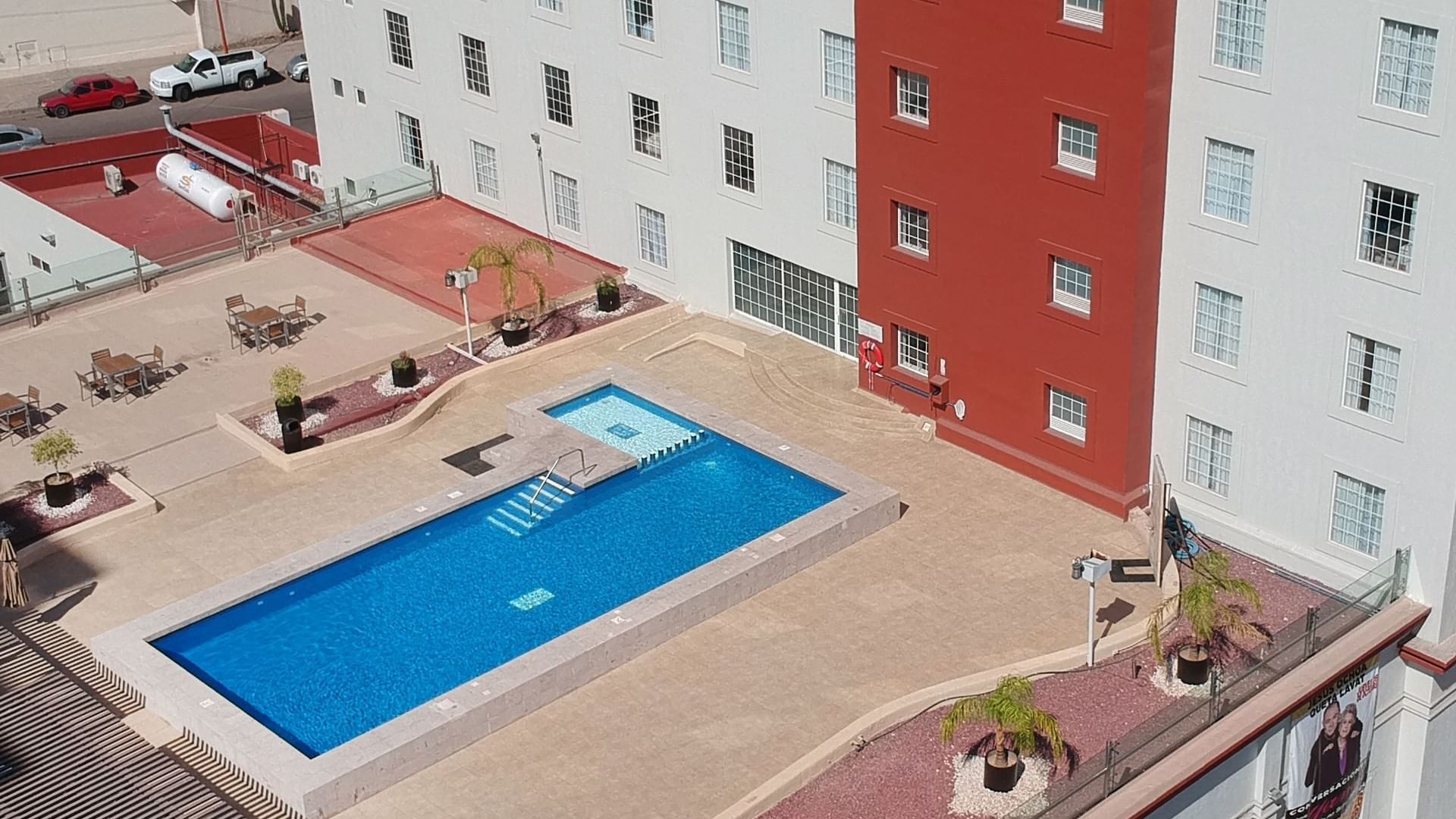 High-angle view of the outdoor pool area at FI Ciudad Obregón