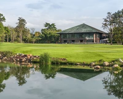 The exterior of Chatrium Golf Resort from the garden