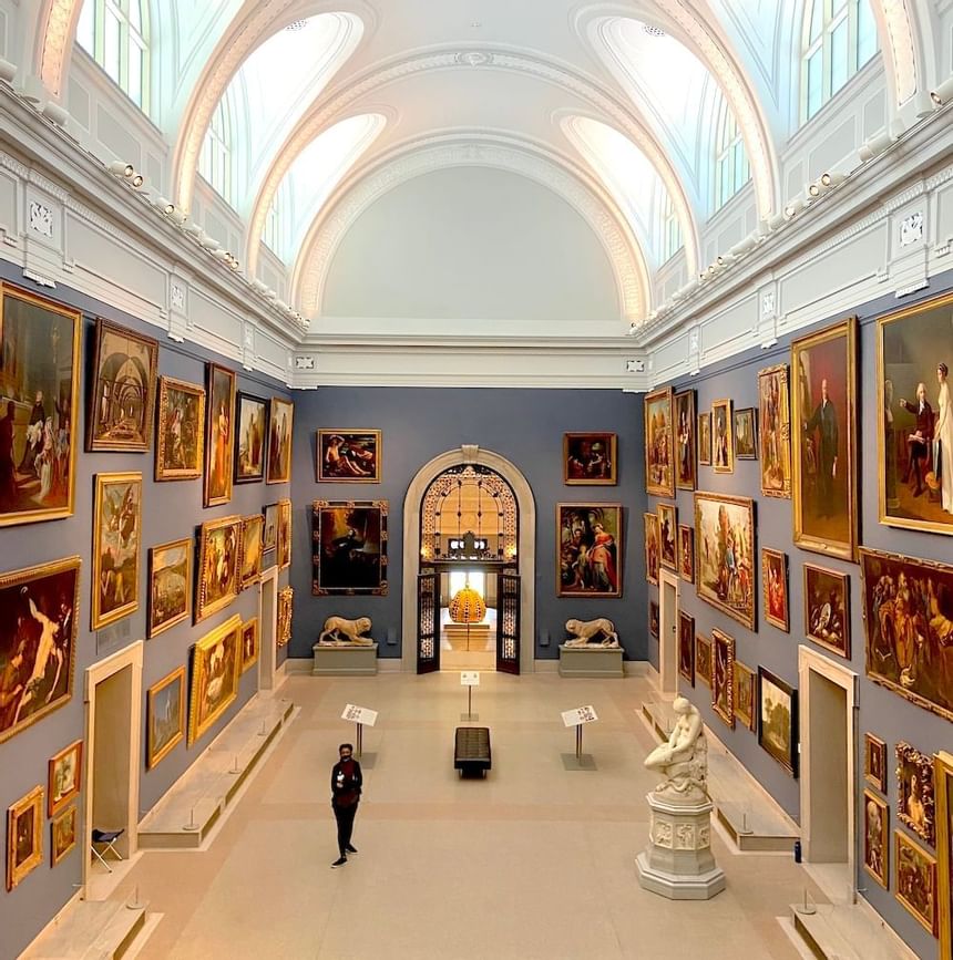 View of the Wadsworth Atheneum Museum of Art with many framed classical paintings & domed ceiling near Avon Old Farms Hotel