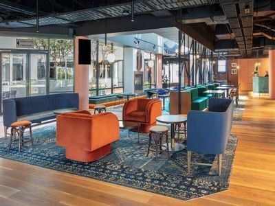 Comfortable seating area in a Restaurant at Amora Hotel