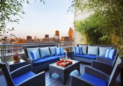 couches and chairs on a rooftop balcony