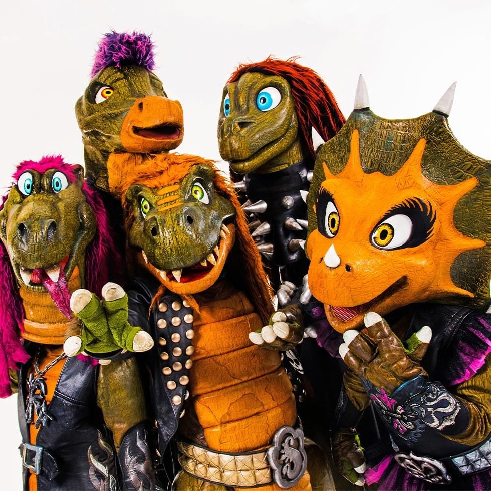 Mascotte di dinosauri rock nel gruppo Heavysaurus per evento Golm Sounds