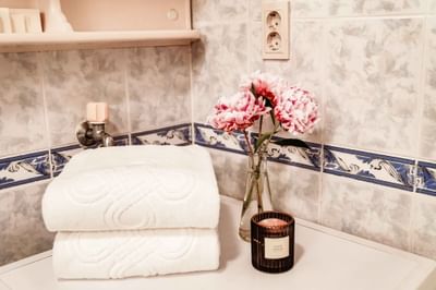 A white towel neatly placed on a counter at Hanoi Daewoo Hotel