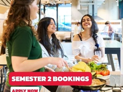 Three students cooking in a kitchen with overlay text Semester 2 Bookings apply now