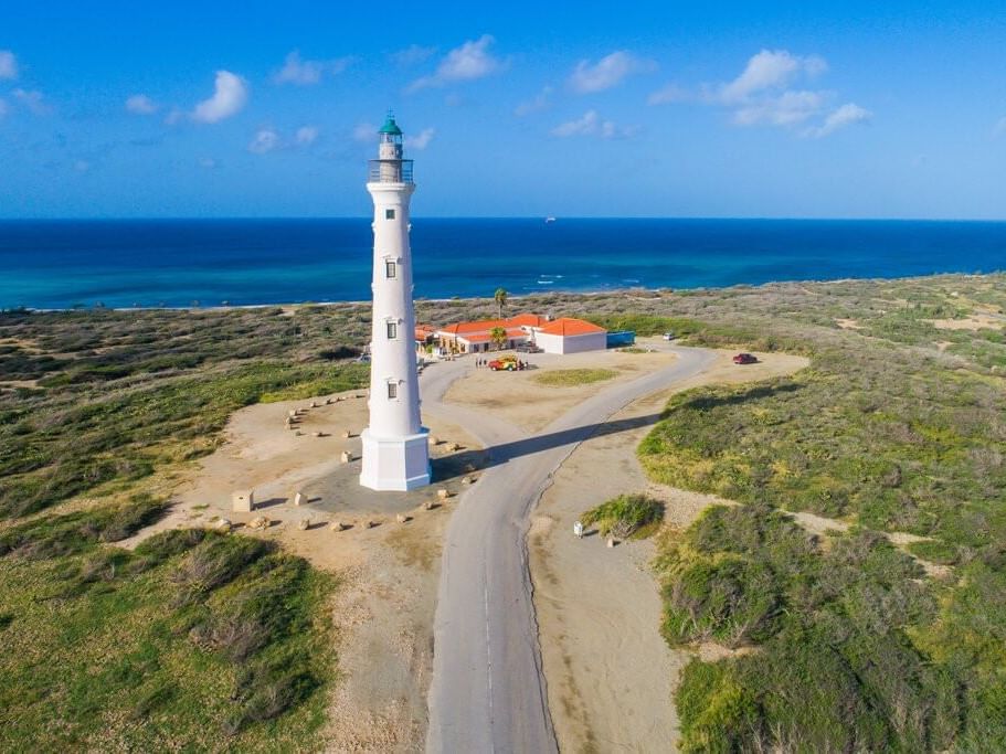 Aerial view of California Lighthouse standing tall near Passions on the Beach