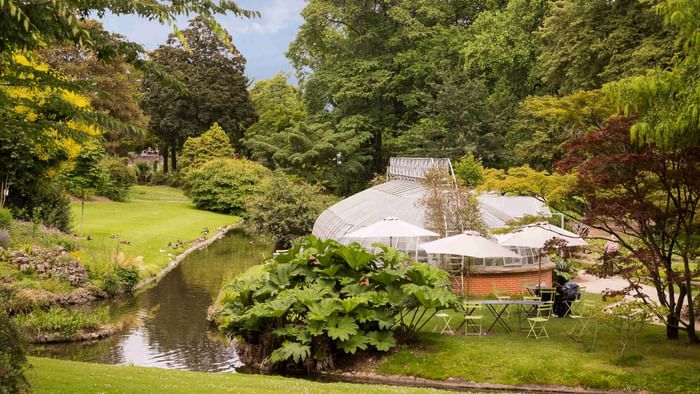 View of a lounge area by a stream at du Grand Monarque