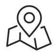 Black and white icon of a map with a pin symbolising a specific location.