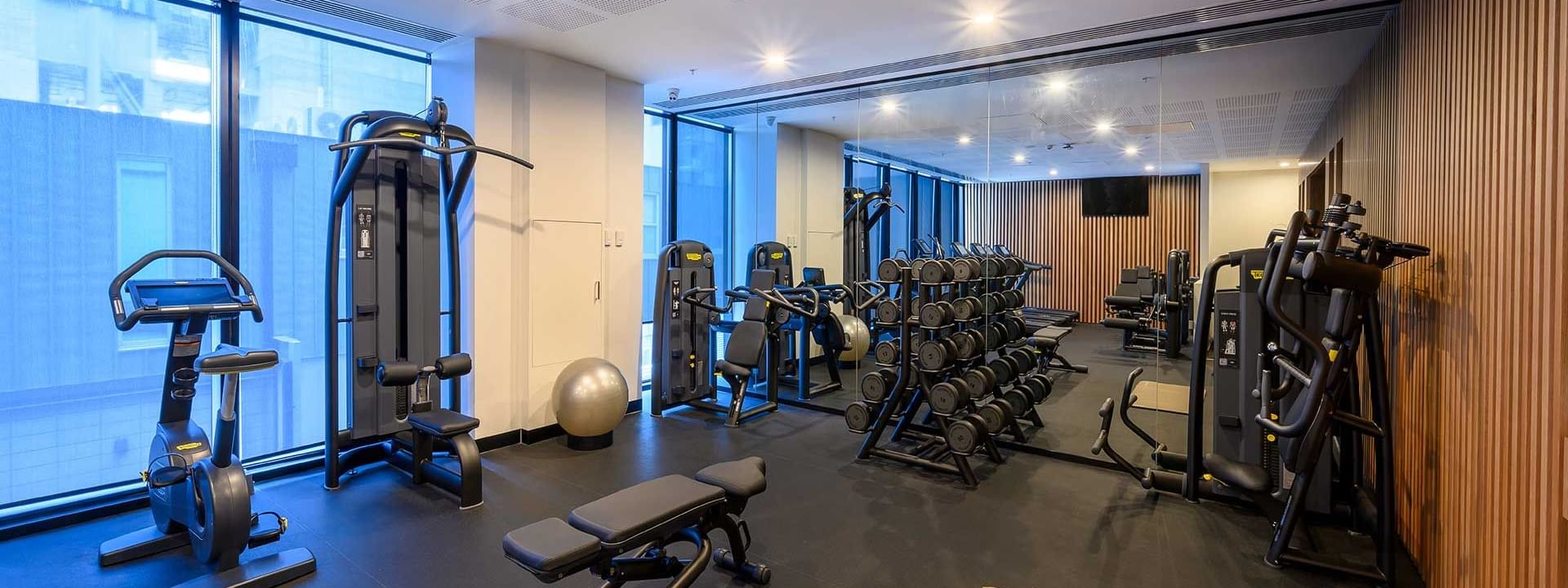 Exercise machines in a gym at Melbourne Central Hotels