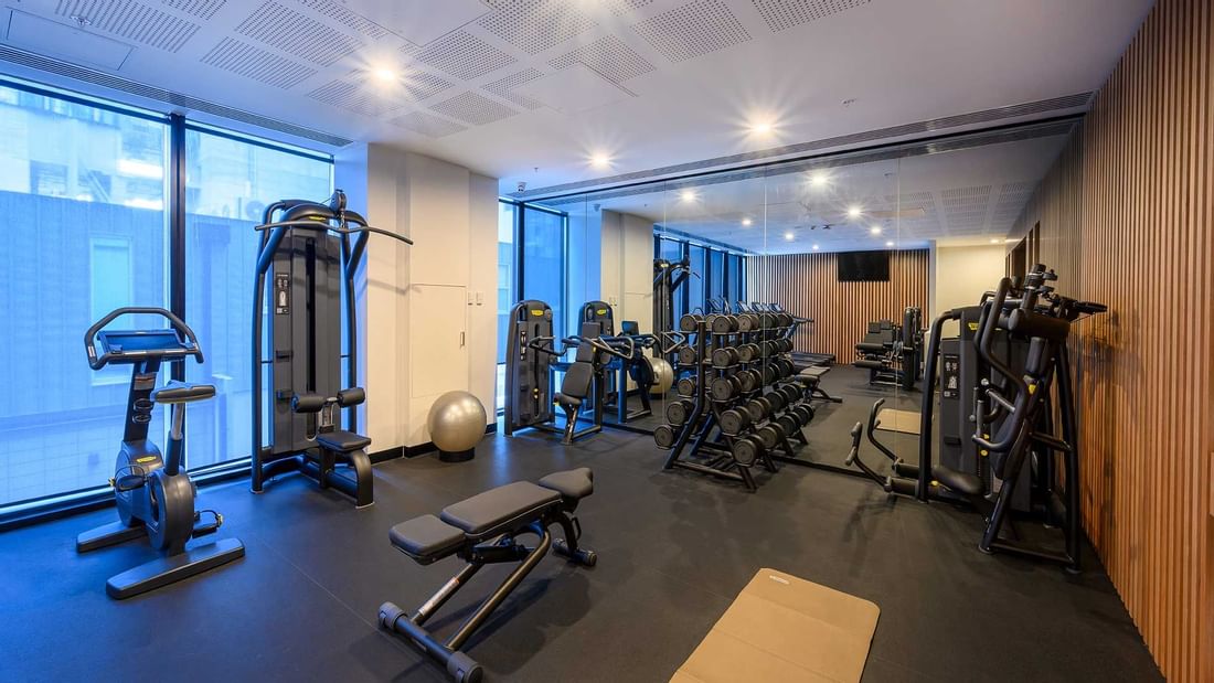 Exercise machines in a gym at Melbourne Central Hotels