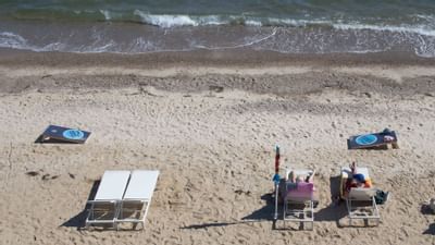 Aerial view of the sun lounges by the beach at Falmouth Tides
