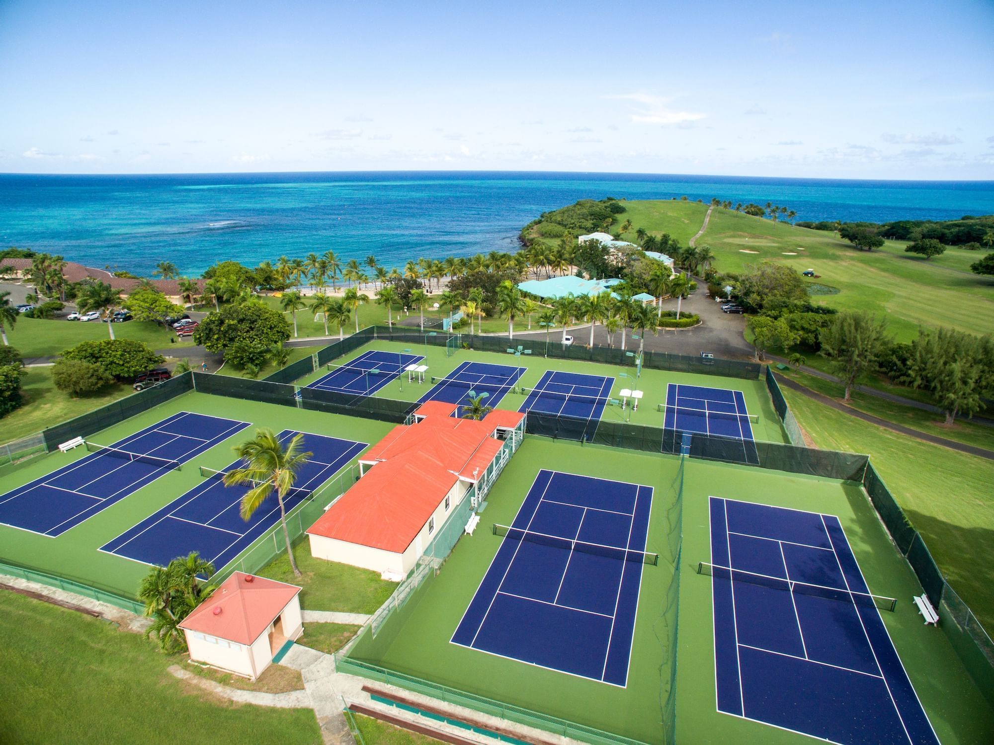 Aerial view of Tennis Courts by the ocean near The Buccaneer