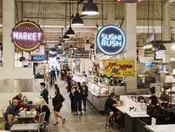 Customers shopping at various shops and stores inside Grand Central Market in Los Angeles CA