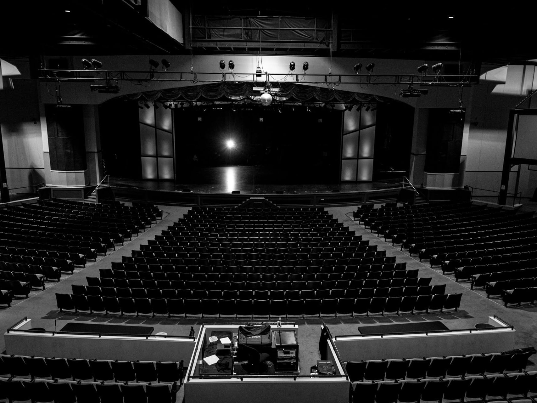 Hillside Theater & Events Center with rows of black seating facing a stage under bright lights at Branson Hillside Hotel