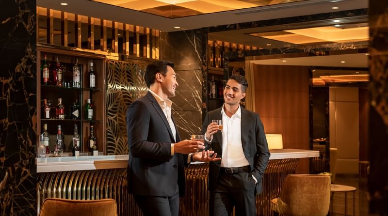2 gentlemen having liquor in a bar at Sunway Resort