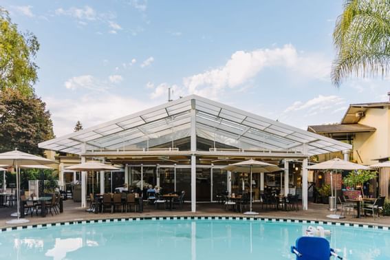 An outdoor swimming pool at Dinah's Garden Hotel