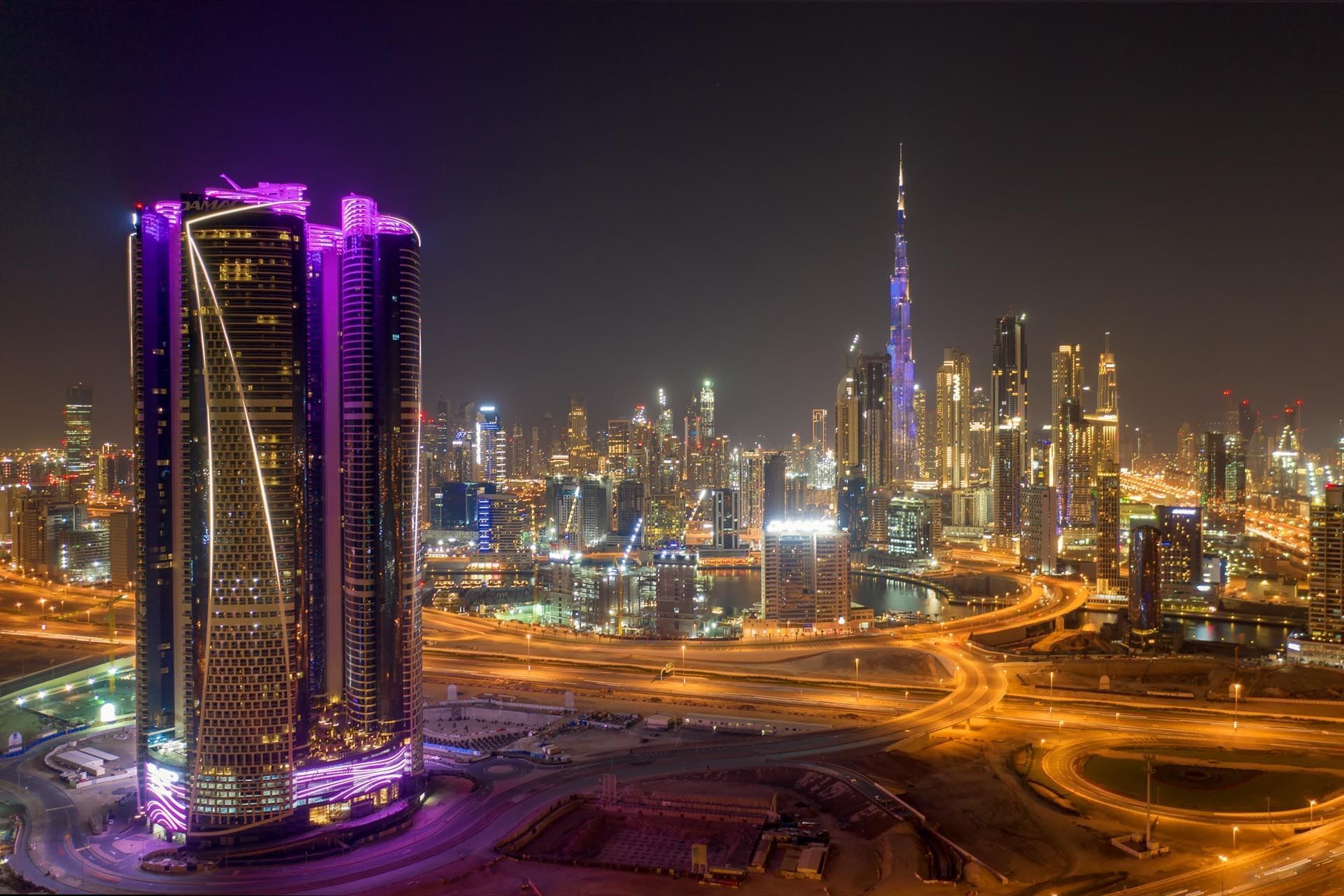 Paramount Hotel Dubai exterior with city night lights