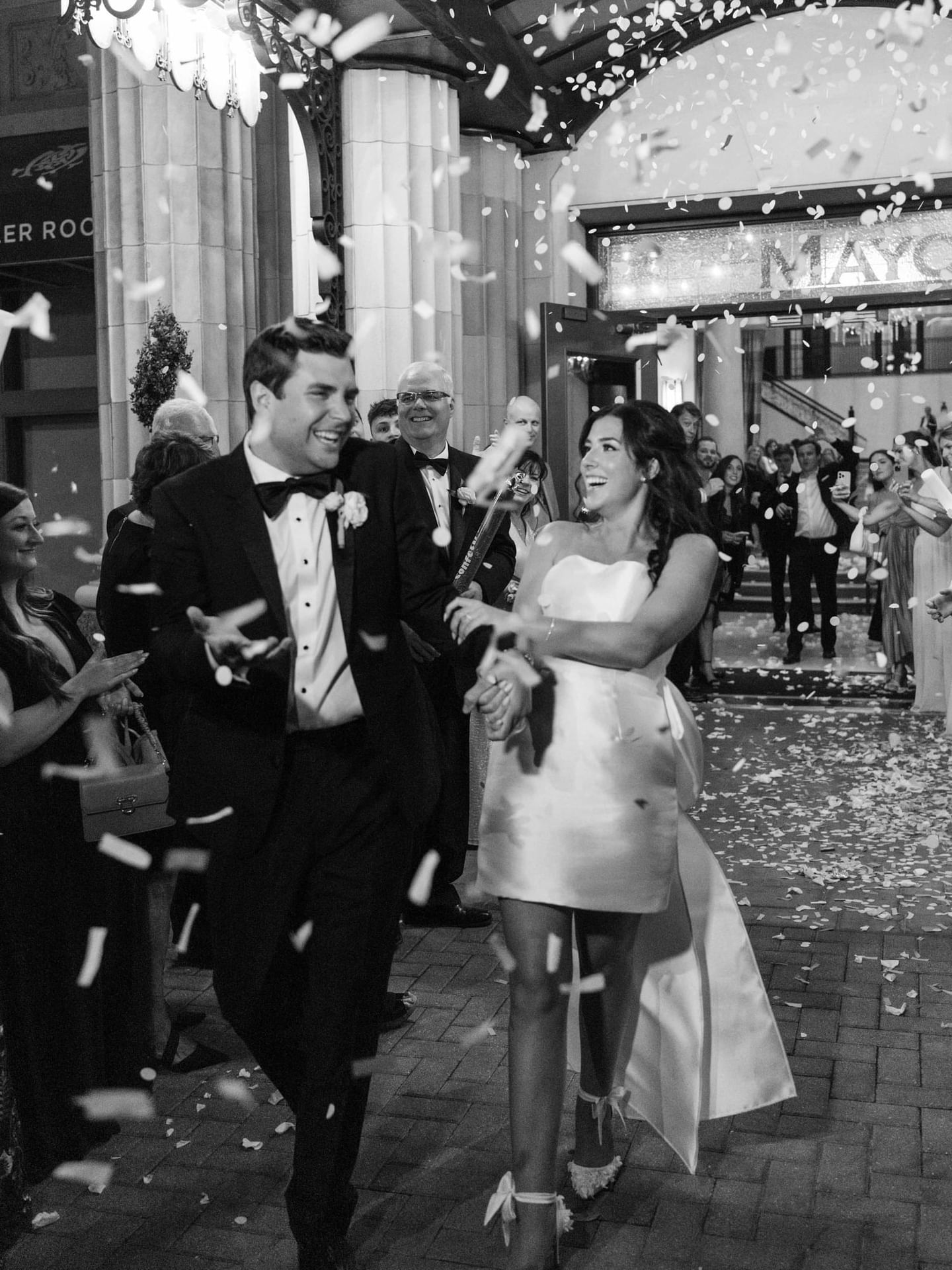 Wedded couple leaving their reception at The Mayo Hotel