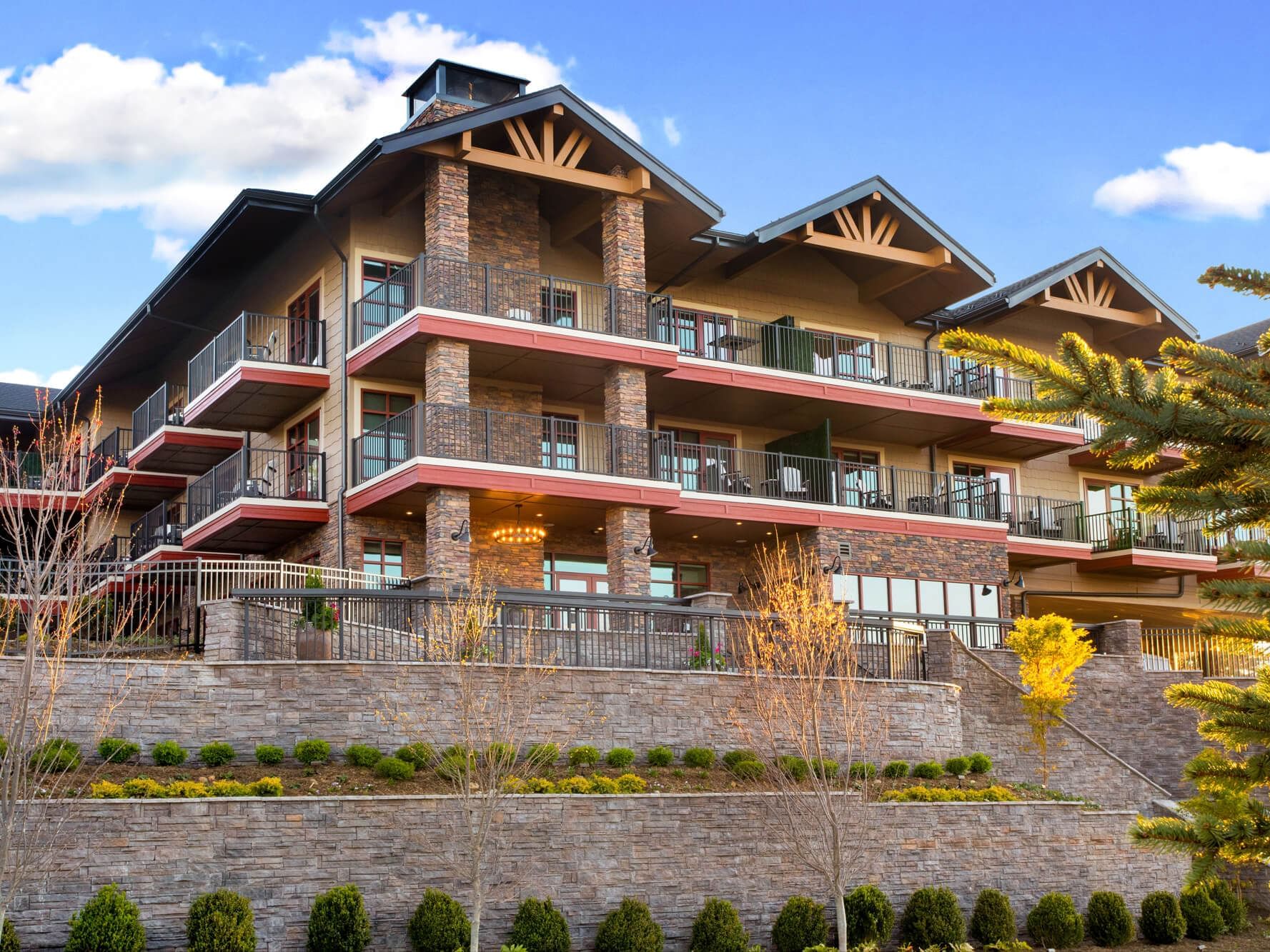 Exterior shot of the back of the Embers Hotel showing the multiple private patios