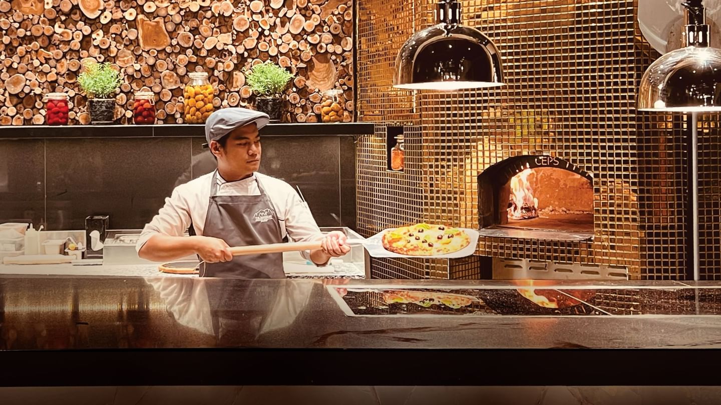 Chef preparing Italian pizza in The Banjaran Ipoh Pizza Dinner at Pomelo Restaurant