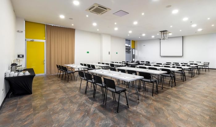 Classroom-type table set-up in a meeting room at 3C Hotels