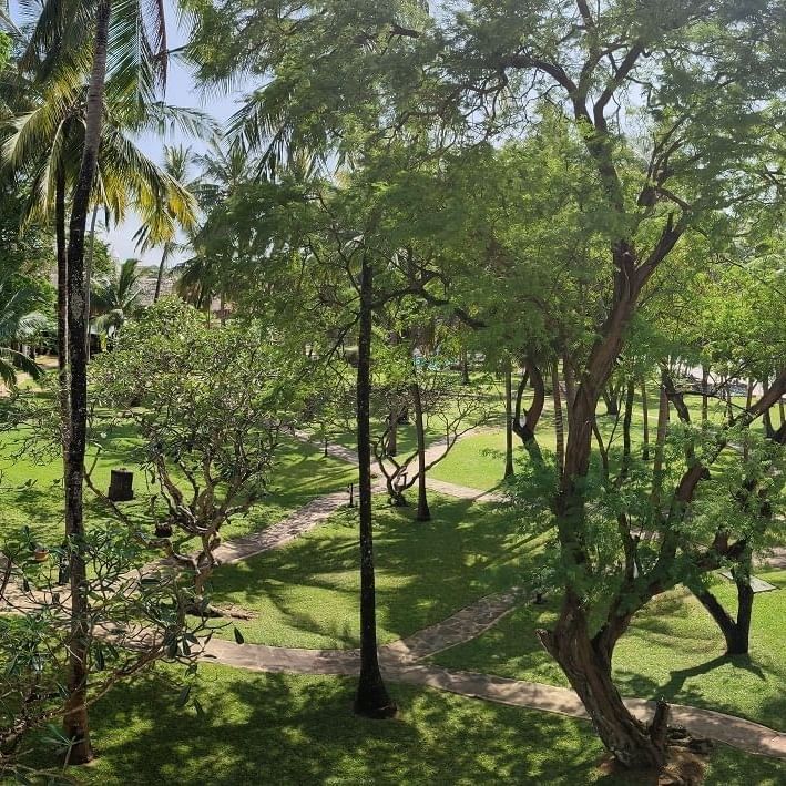 Panoramic view of lush gardens and pathways at Serena Beach Resort & Spa in Mombasa.