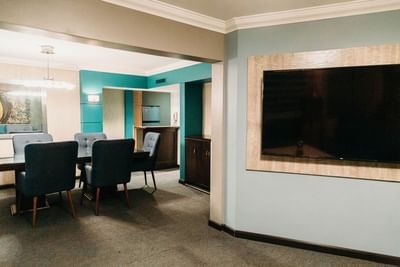 TV & dining table in Governor Suite at Araiza Mexicali