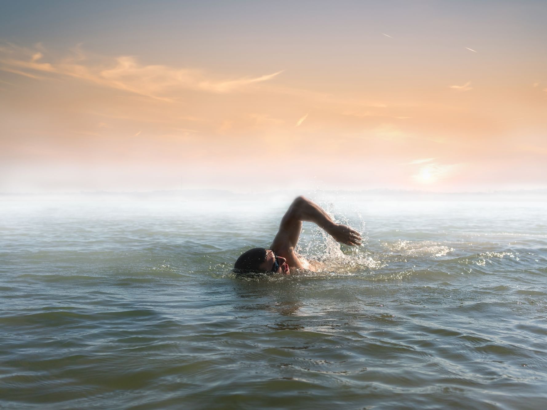 Person swim in open water near Daydream Island Resort