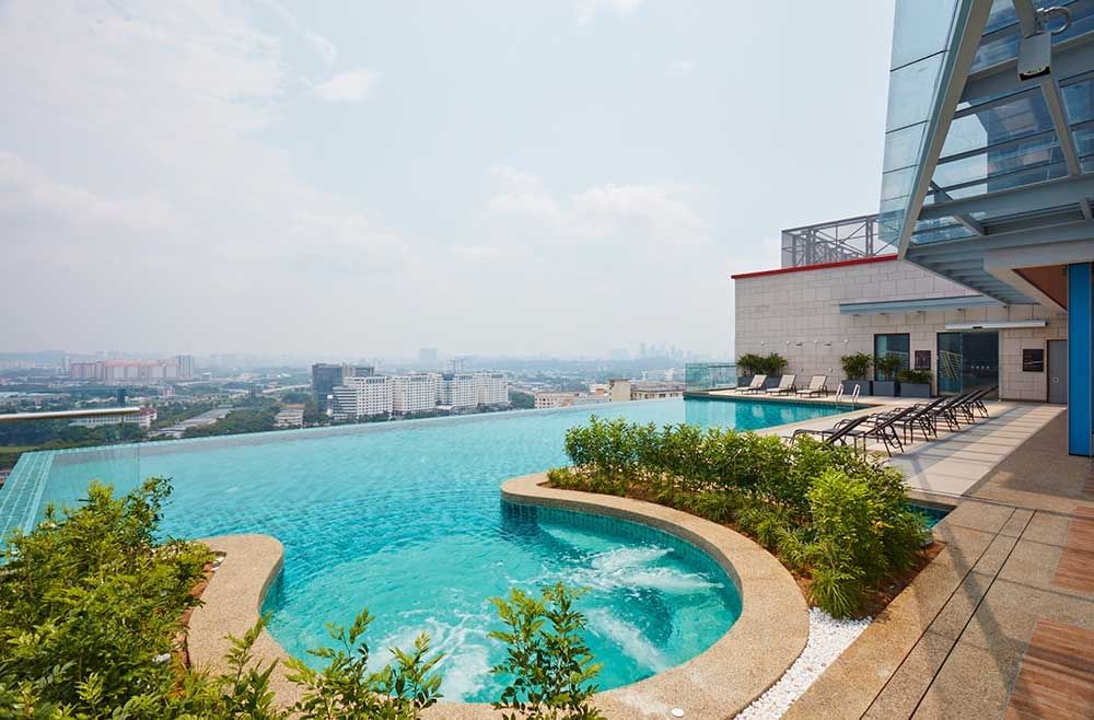Jacuzzi at Sunway Velocity Hotel rooftop Infinity pool looking out to Kuala Lumpur skyline view