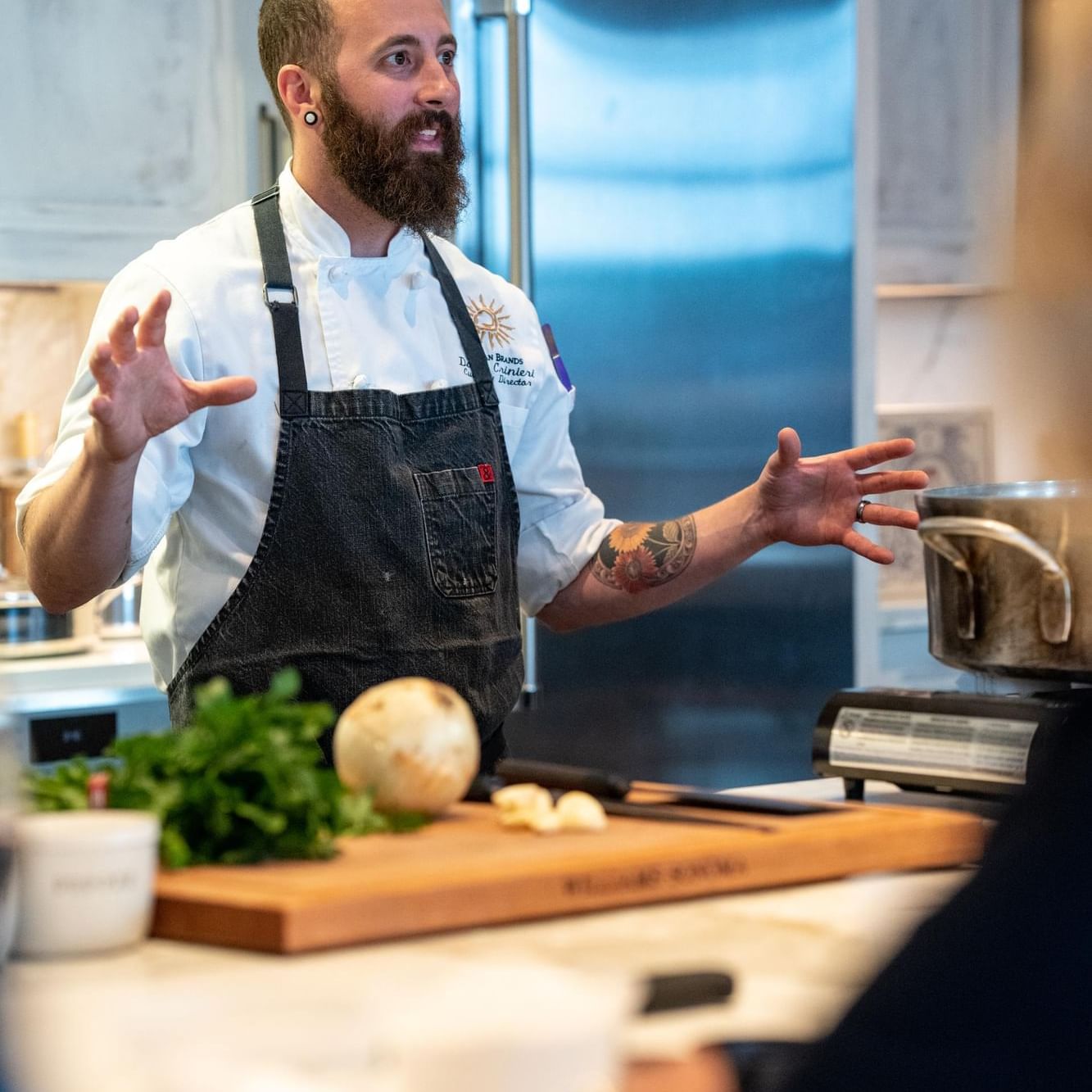 Chef Dave explaining at Dave Cooking Class Show at The Artisan Hotel at Tuscan Village