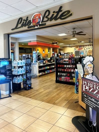 The open entrance to a convenience store with a sign that reads "Lite Bite Gifts & Deli"