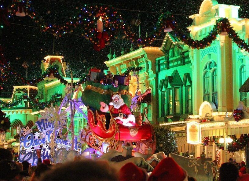 Santa Claus on a festive float at Mickey’s Very Merry Christmas Party near Lake Buena Vista Resort Village & Spa