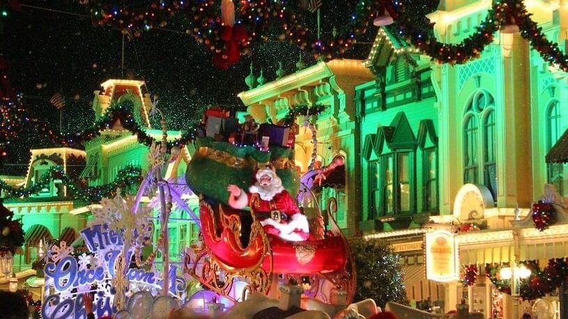 Santa Claus on a festive float at Mickey’s Very Merry Christmas Party near Lake Buena Vista Resort Village & Spa