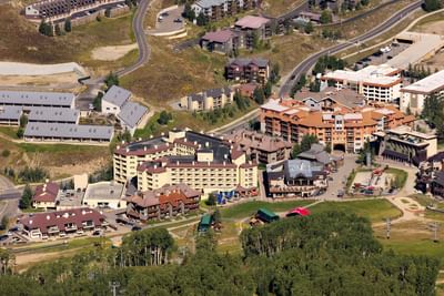 Aerial view of Elevation Resort & Spa complex with buildings, roads, and greenery