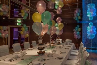 Well-arranged table for a baby shower at Orsett Hall Hotel